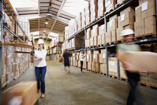 Dedicated staff in a bustling warehouse, efficiently managing stocks and inventory. Experience seamless control over your wholesale operations with our comprehensive management system.