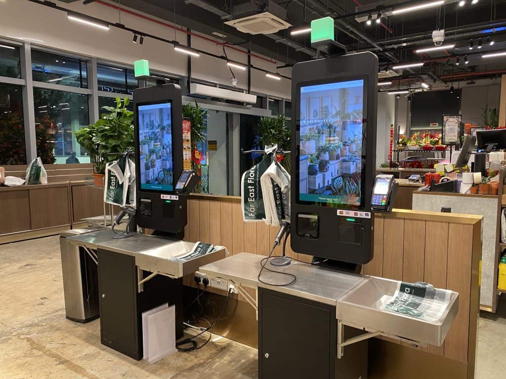 Self-checkout kiosks at Far East Flora